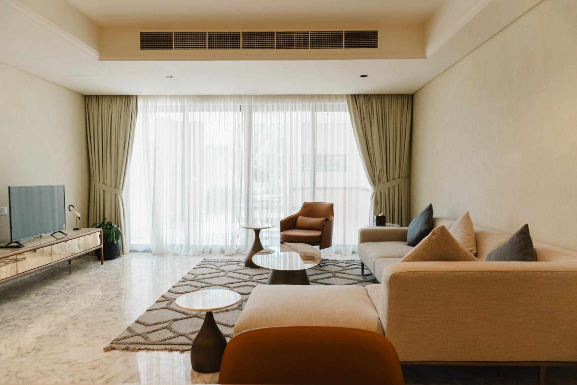 Palavra Resort Manama Eksteriør billede A living room in a condominium