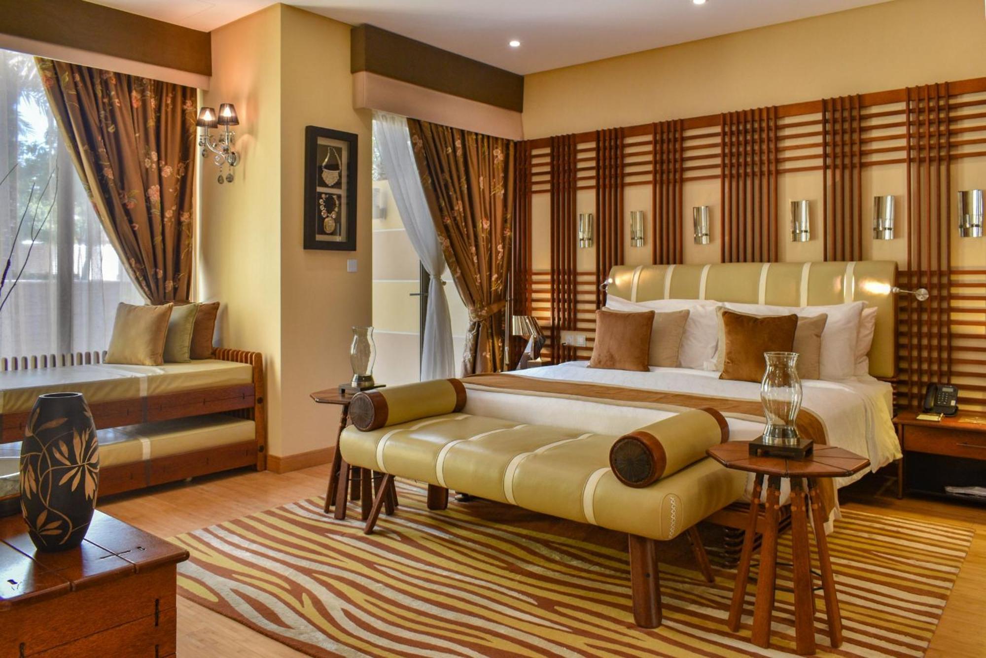 Palavra Resort Manama Eksteriør billede A bedroom at the Taj Bengal